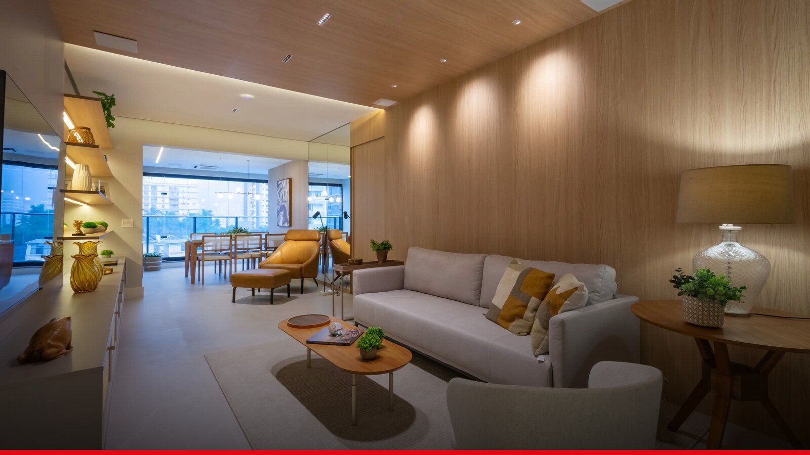 Sala de estar integrada com varanda em apartamento decorado da Plano & Forma
